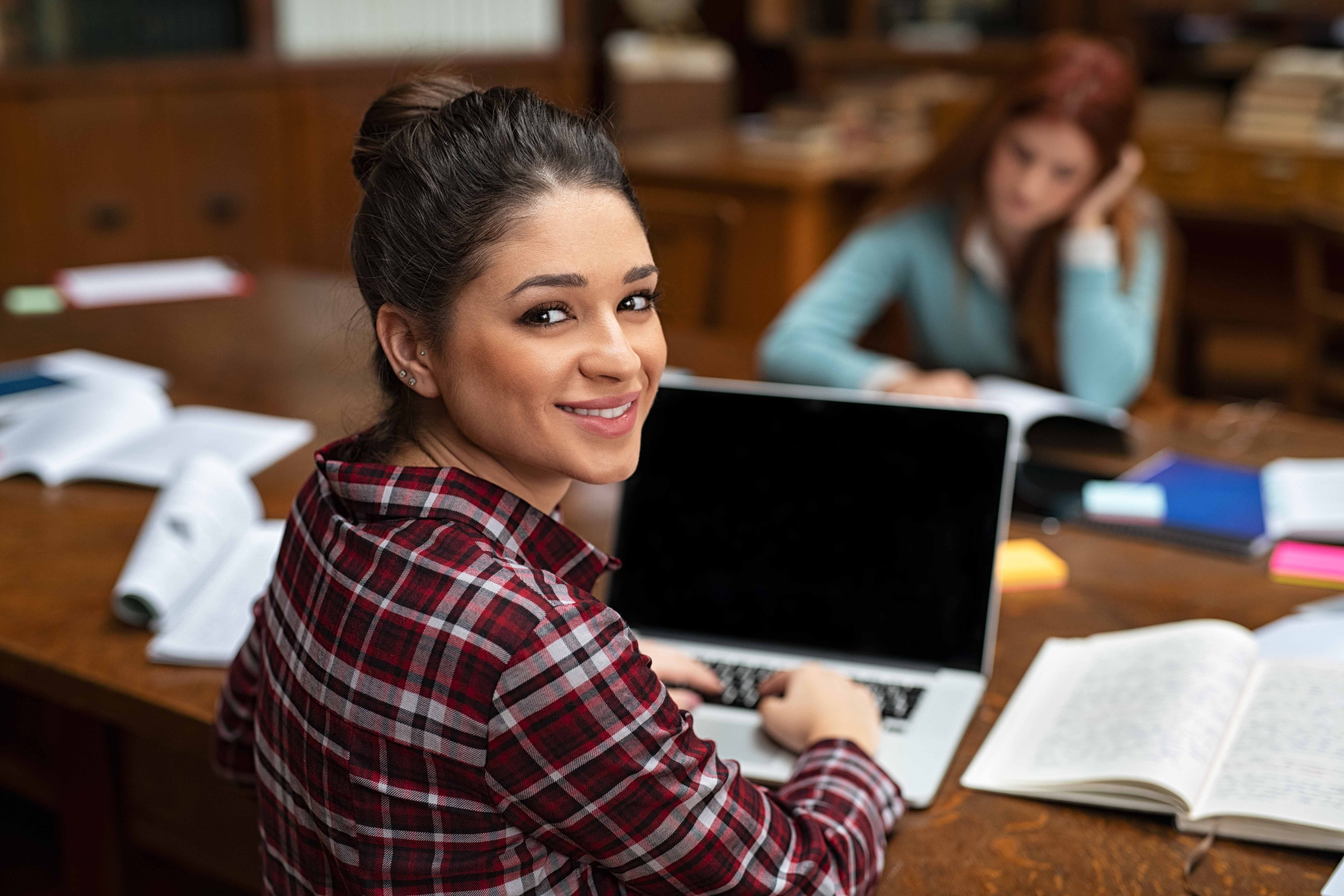 college student studying at library