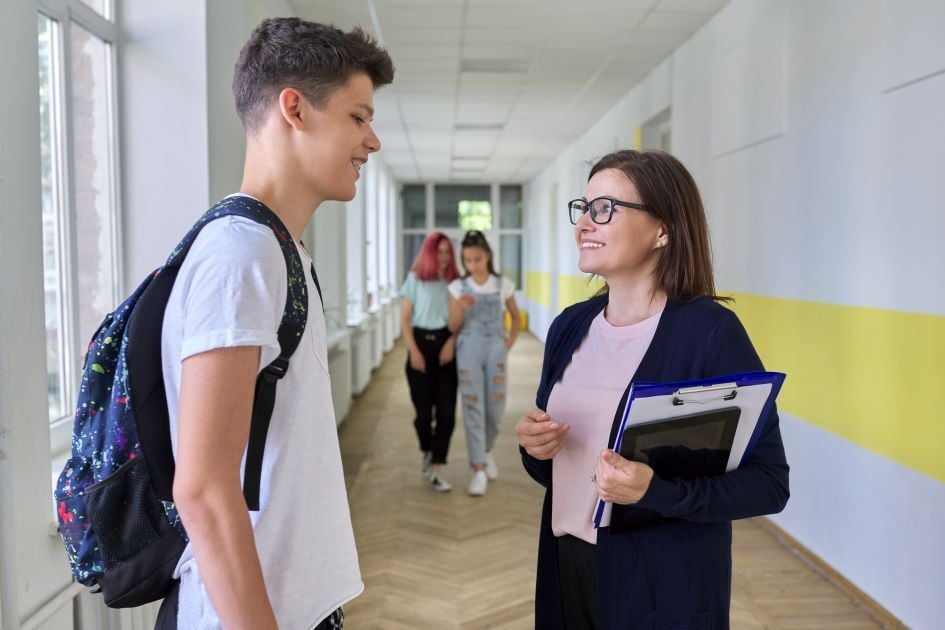 male student and teacher