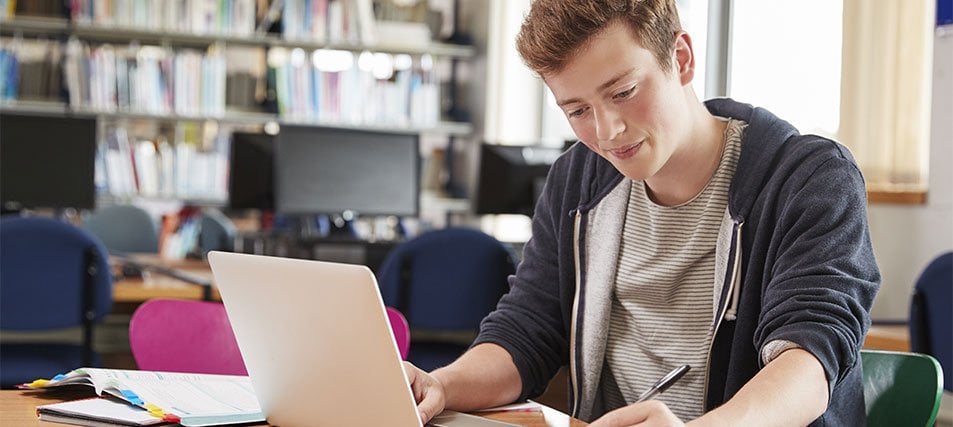 male student in library