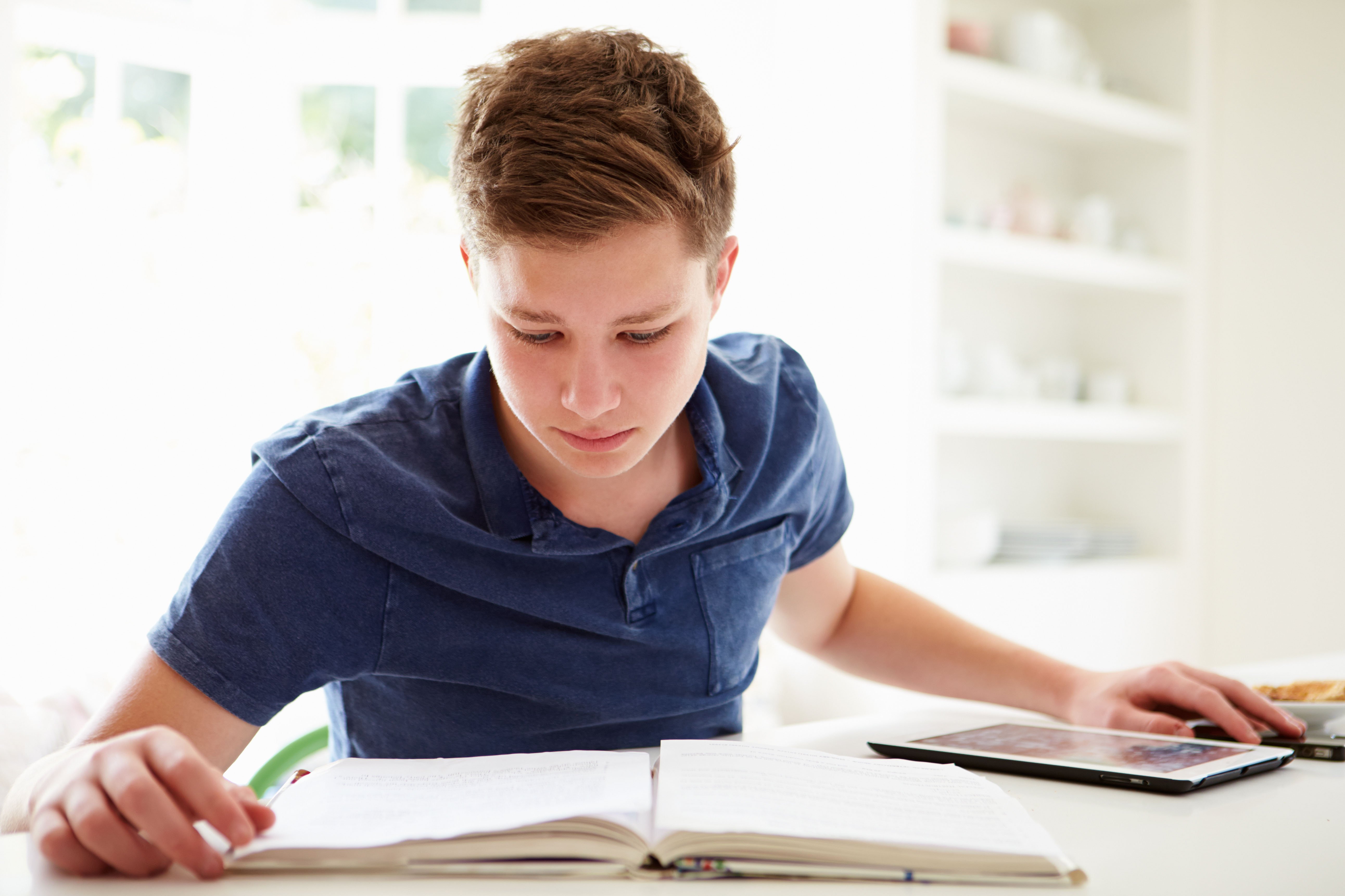 student deciphering financial aid letter on desk